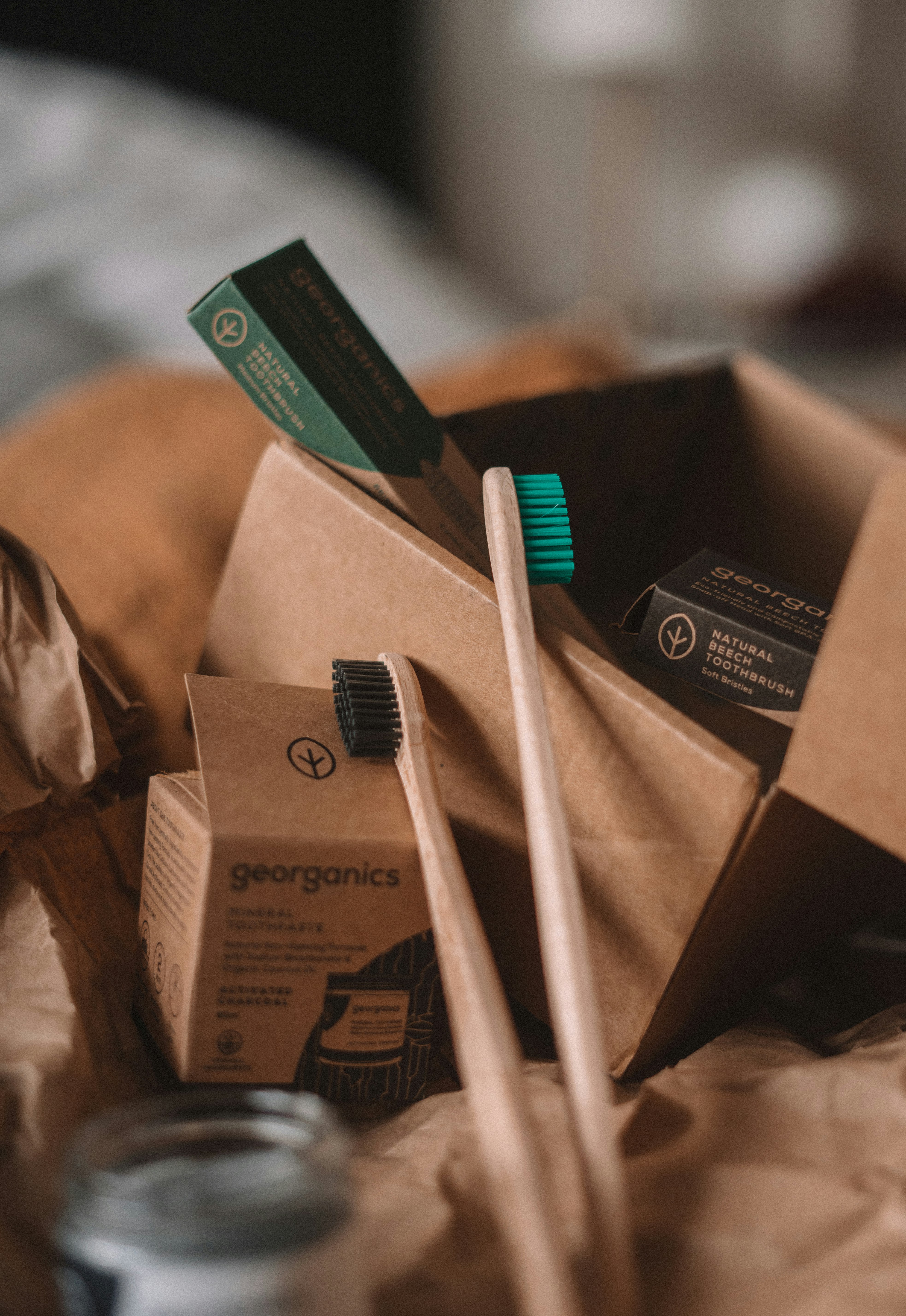 green and white toothbrush on brown carton box